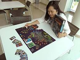 lady checking a board game