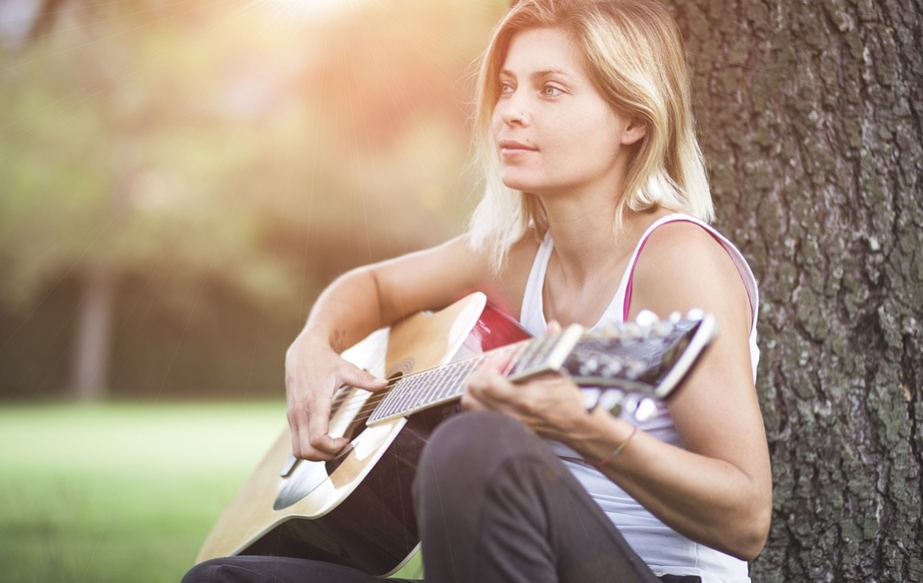 woman playing guitar